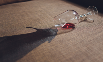 Red wine stain being professionally removed from commercial upholstery using Tuft & Weave’s stain removal service in Sydney.