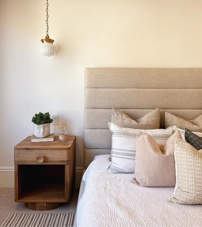 Sydney mattress cleaning by Tuft & Weave — bright neutral bedroom with layered white bedding and warm accents