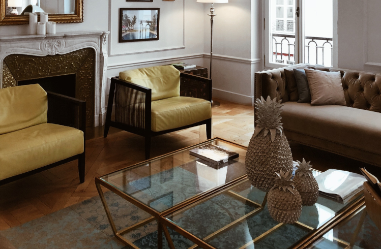 Lounge room with yellow leather armchairs and beige sofa