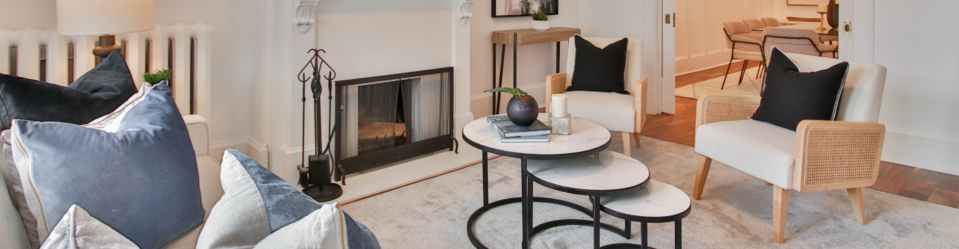Lounge room with cream rug and cream armchairs