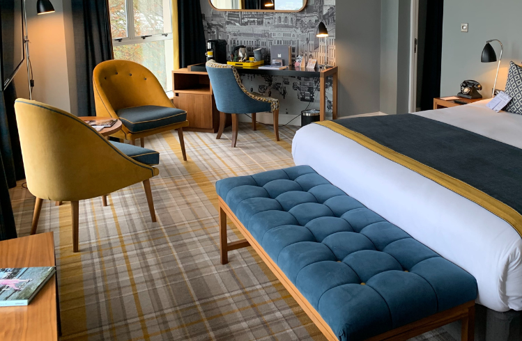 Modern hotel bedroom with patterned carpet after professional commercial carpet cleaning in Sydney by Tuft & Weave