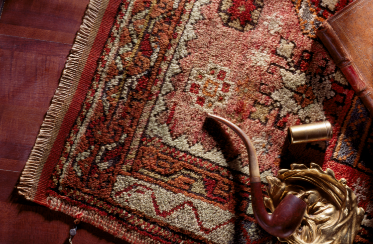 Patterned rug with a pipe on it