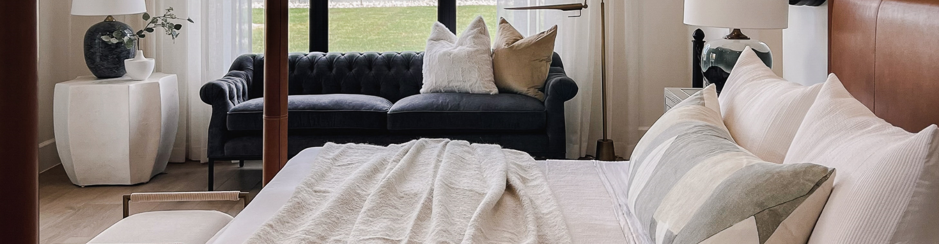 Tuft & Weave mattress cleaning Sydney — elegant bedroom with white bedding and blue sofa