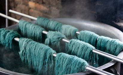 Fabric in the process of being dyed blue